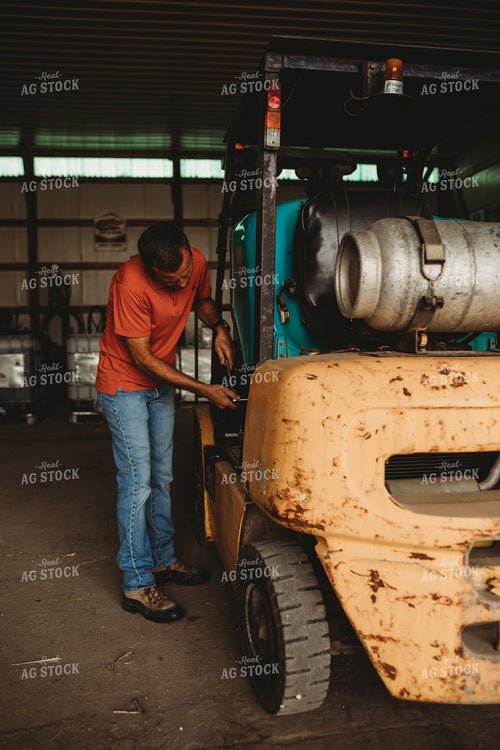 Farmer Working on Equipment 4515