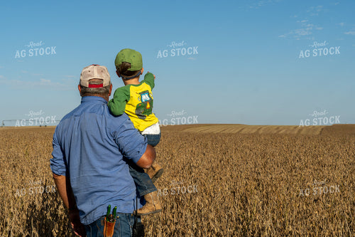 Farmer and Farm Kid Checking Beans 65091