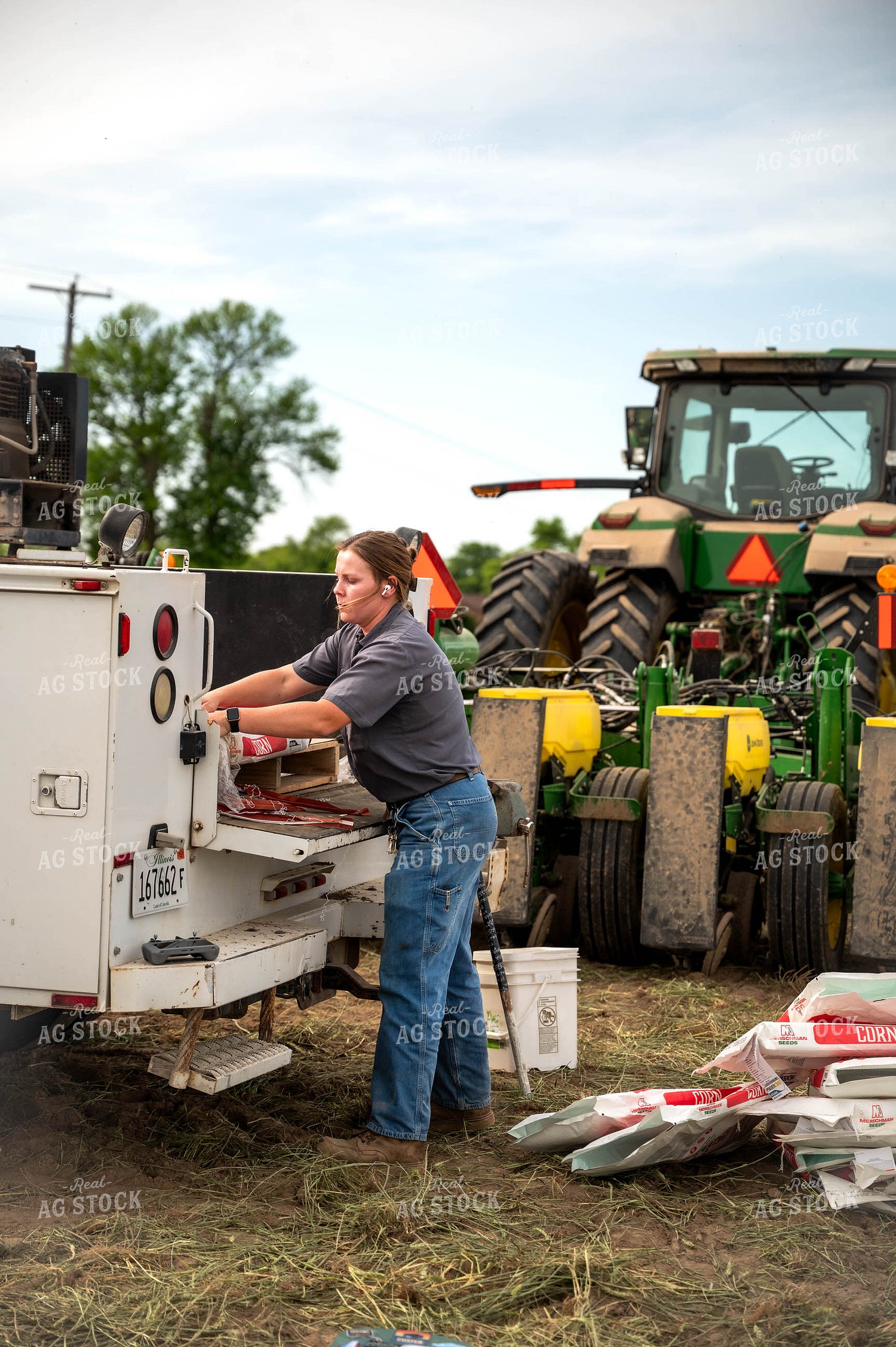 Female Farmer Filling Planter 115640