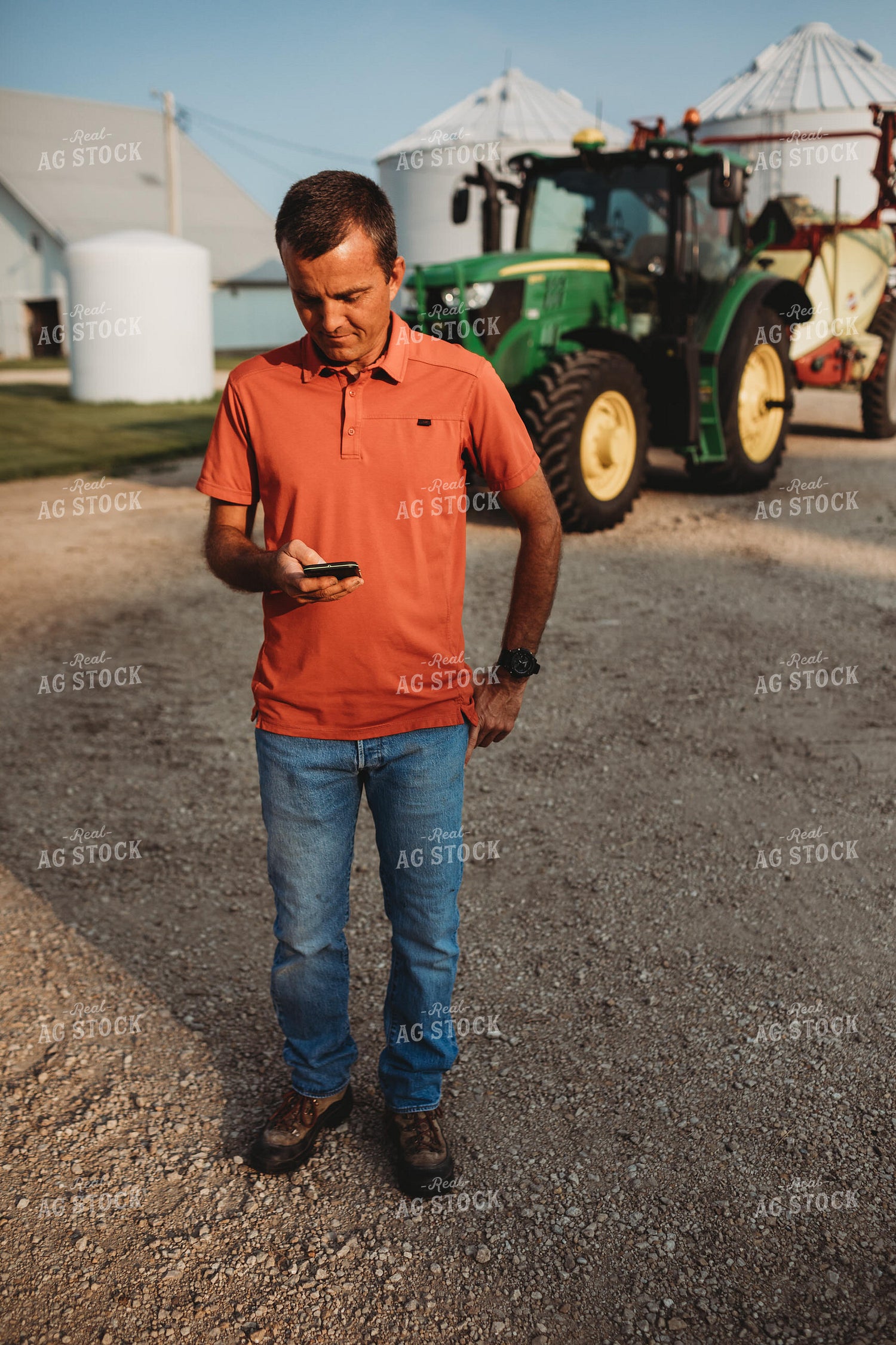 Farmer on Phone Outside of Tractor 4532