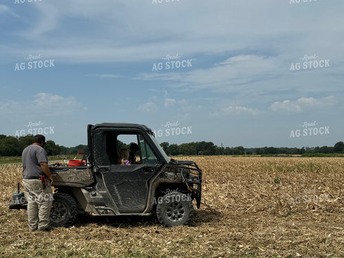 Farmer with Side by Side in Field 228019