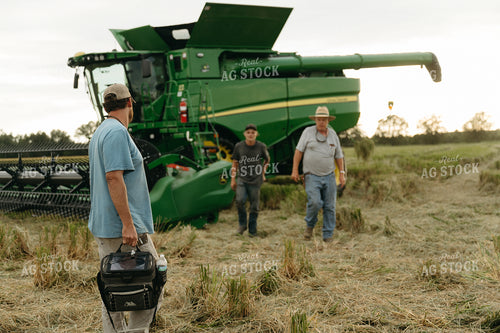 Farmers by Combine in Rice Field 125273