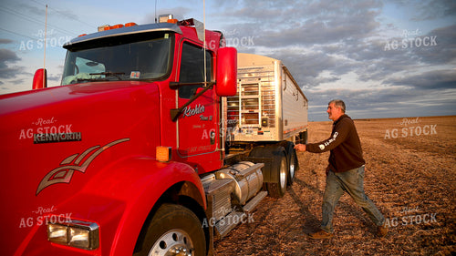 Farmer Climbing into Semi Cab 25732