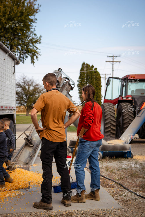 Farm Family Dumping Corn into Grain Pit 268102