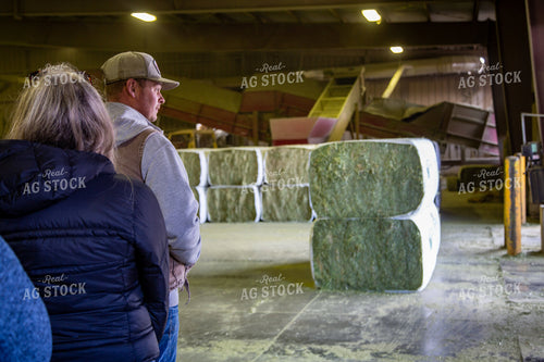 Farmers in Barn of Hay Bales 130015