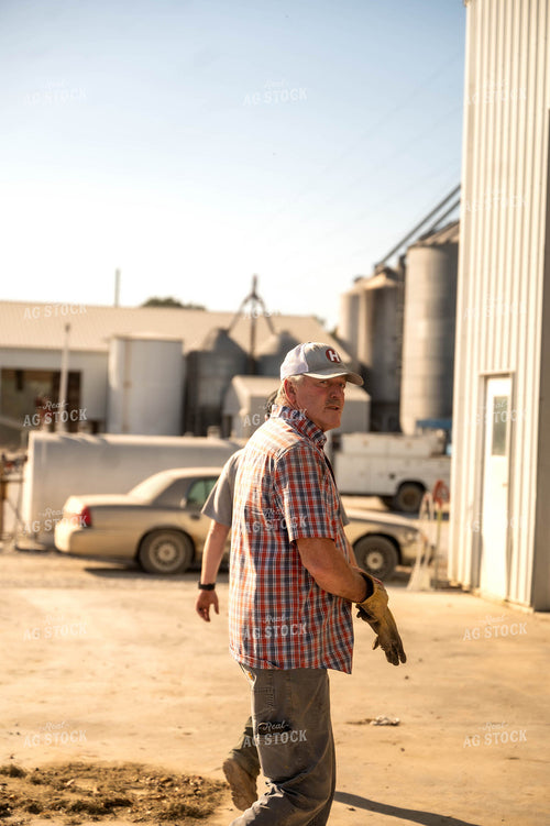 Farmer Walking by Shed 115523