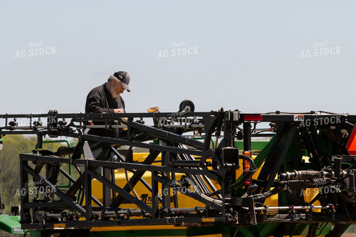 Farmer Fixing Sprayer 157131