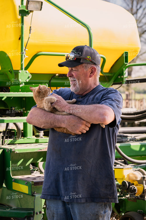 Farmer Holding Cat 128012