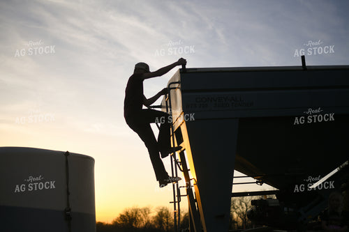 Farmer Climbing Down Seed Tender 191012