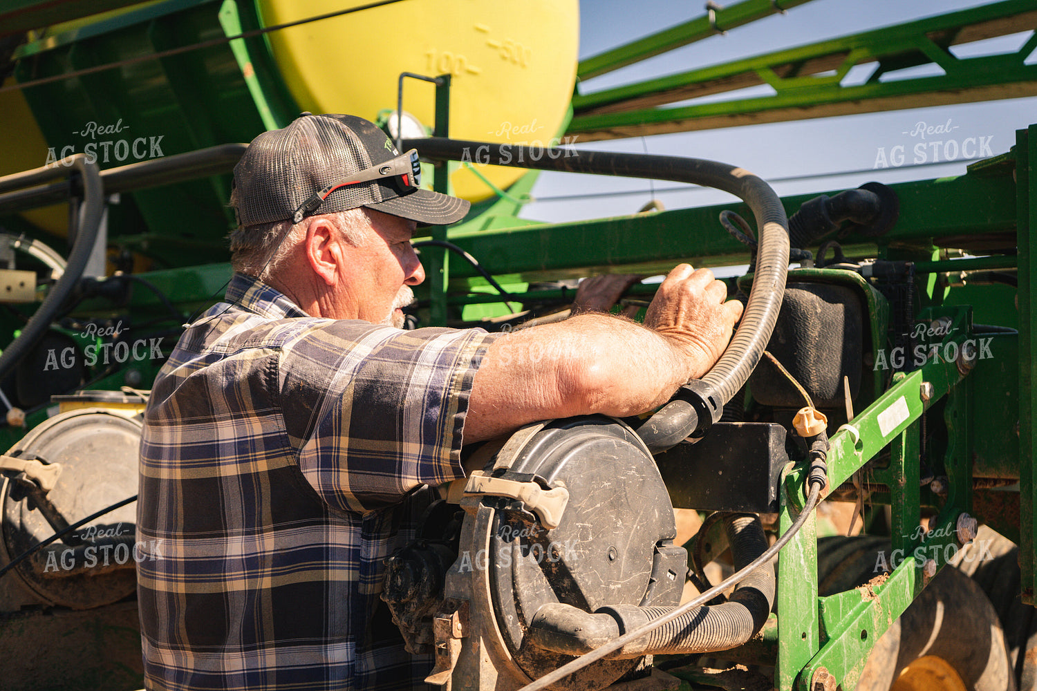 Farmer Working on Planter 128021