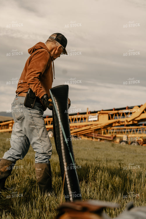 Farmer Working on Irrigation System 58223