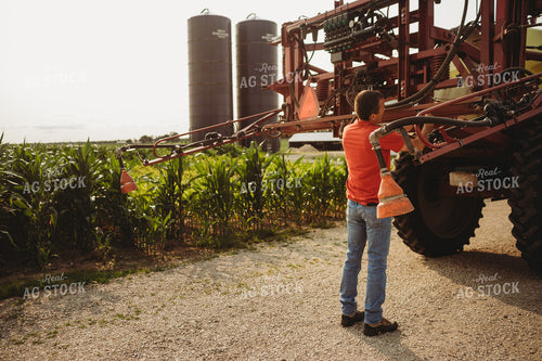 Farmer Checking Sprayer Nozzles 4447