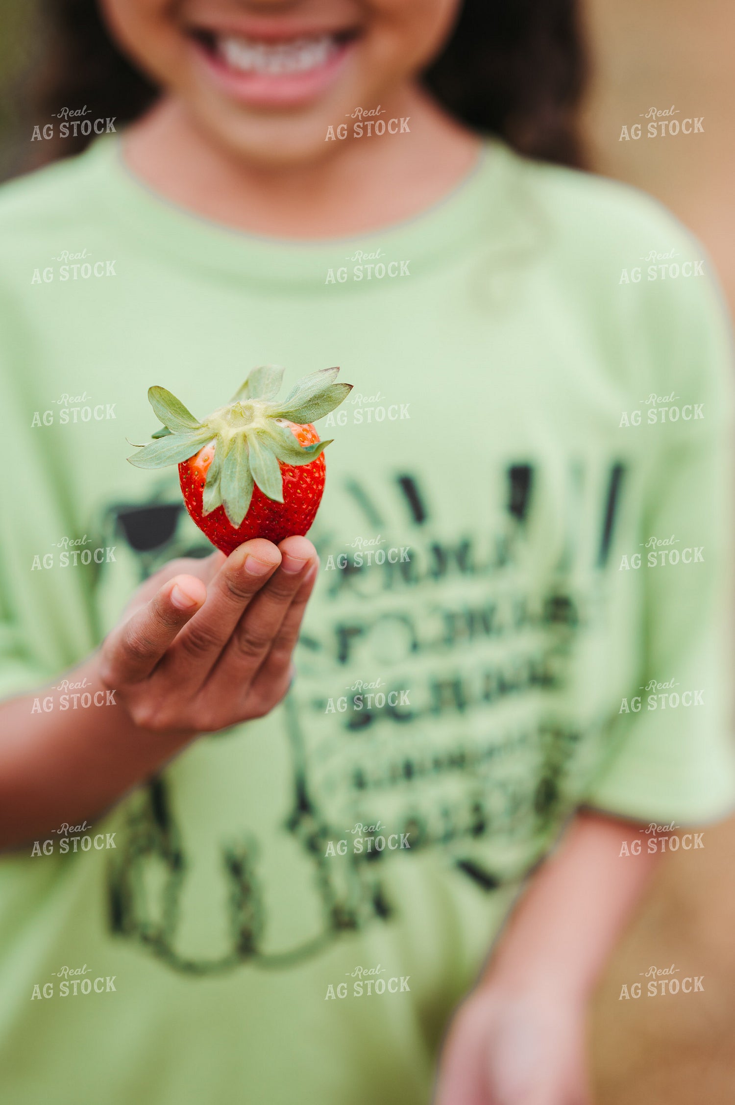 Holding a Strawberry 125093