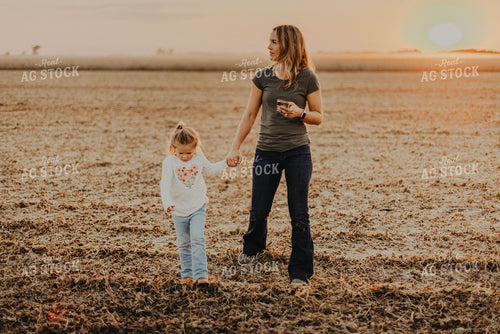 Farm Wife Walking with Daugher in Field 9271