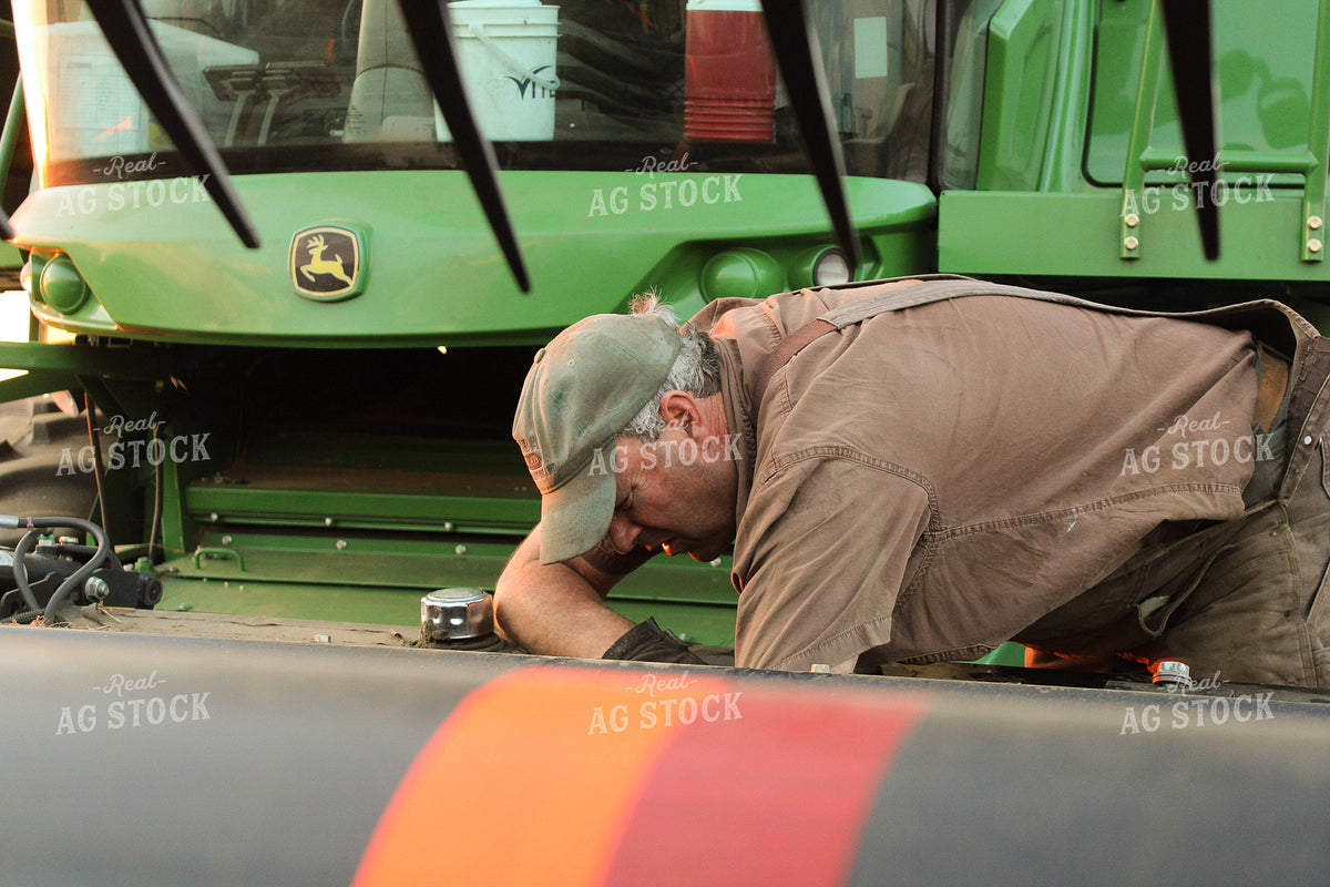 Farmer Working on Equipment 187356