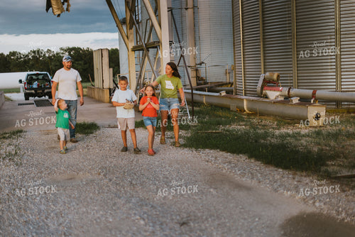 Farm Family Walking by Grain Bins 8777