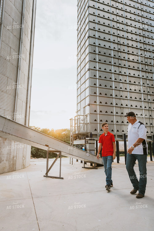 Farmers Walking by Grain Leg 7794