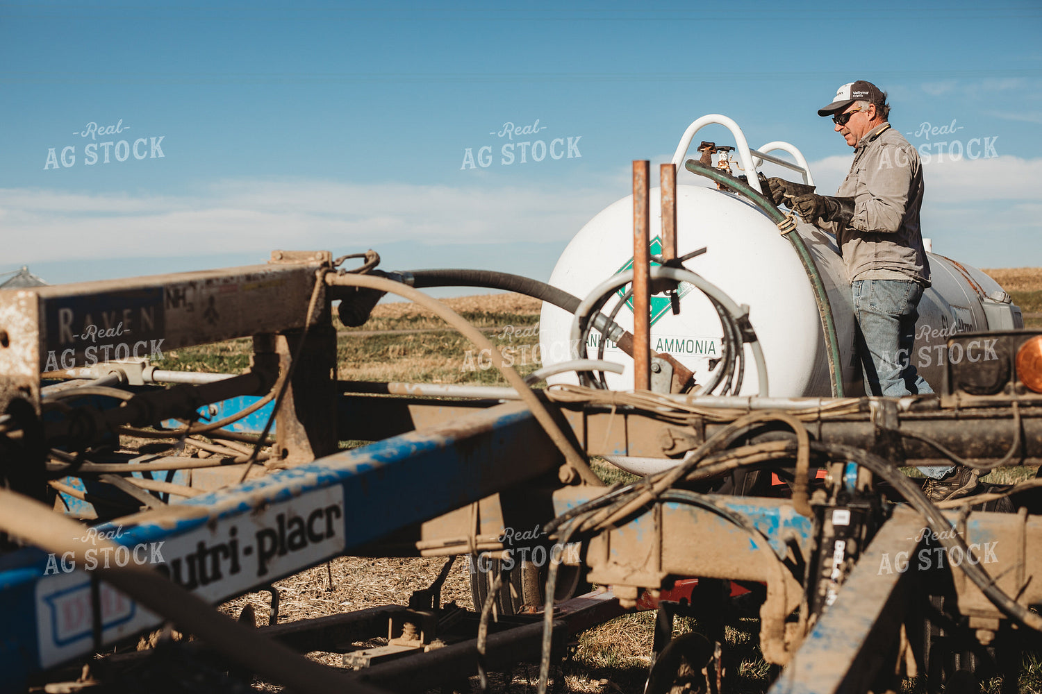 Farmer Hooking Up Anhydrous Ammonia Tank 3572