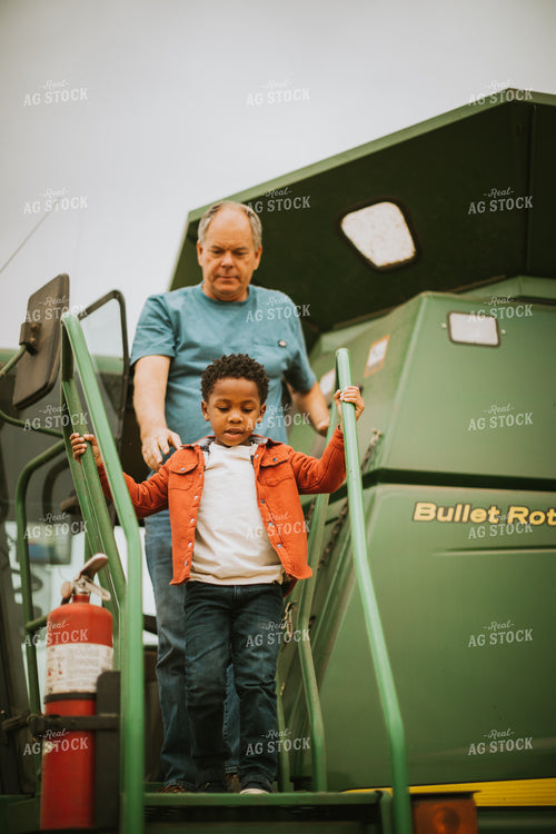 Farmer and Farm Kid Exiting Combine 6671