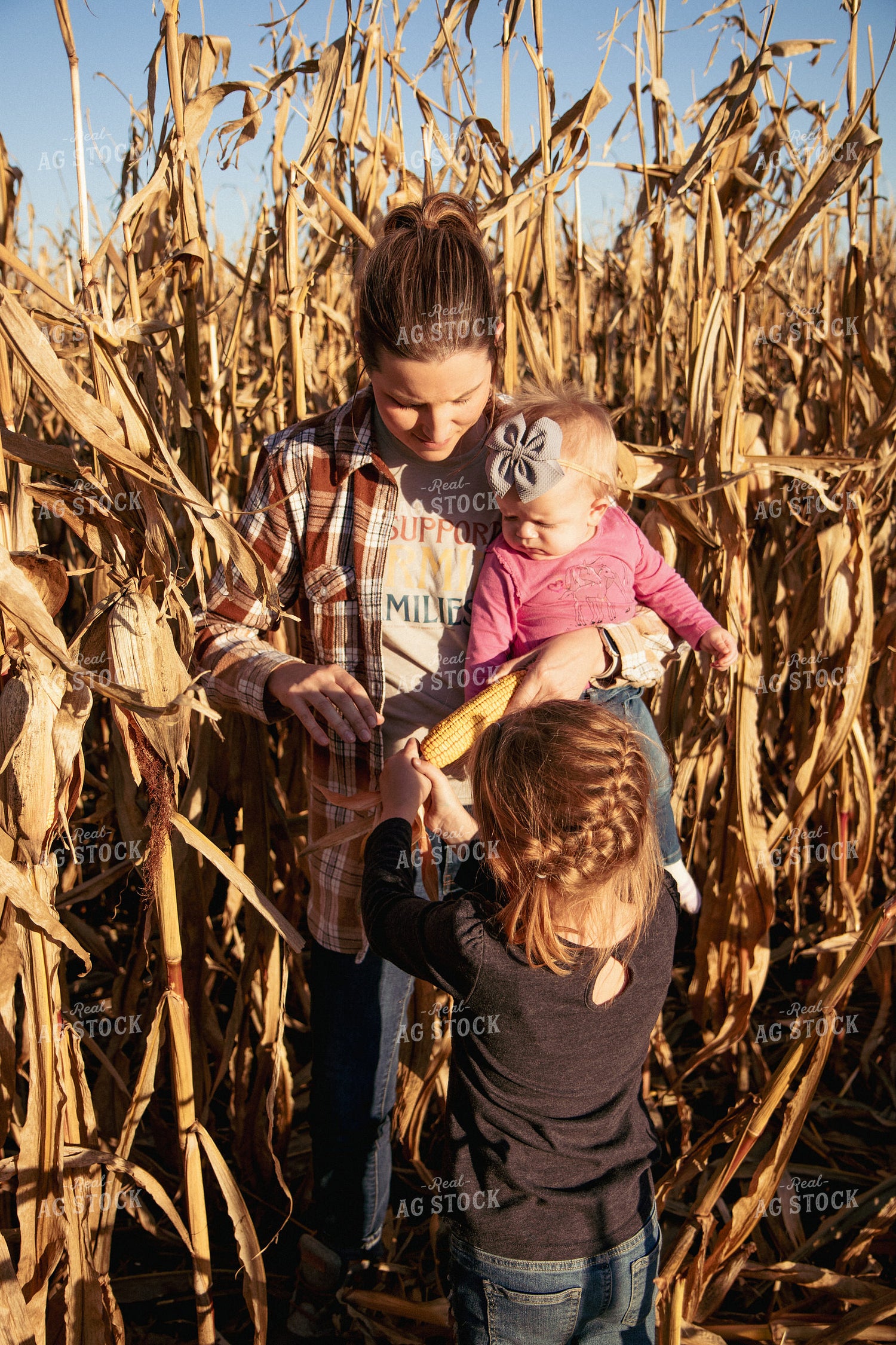 Female Farmer and Kids Checking Corn 67547