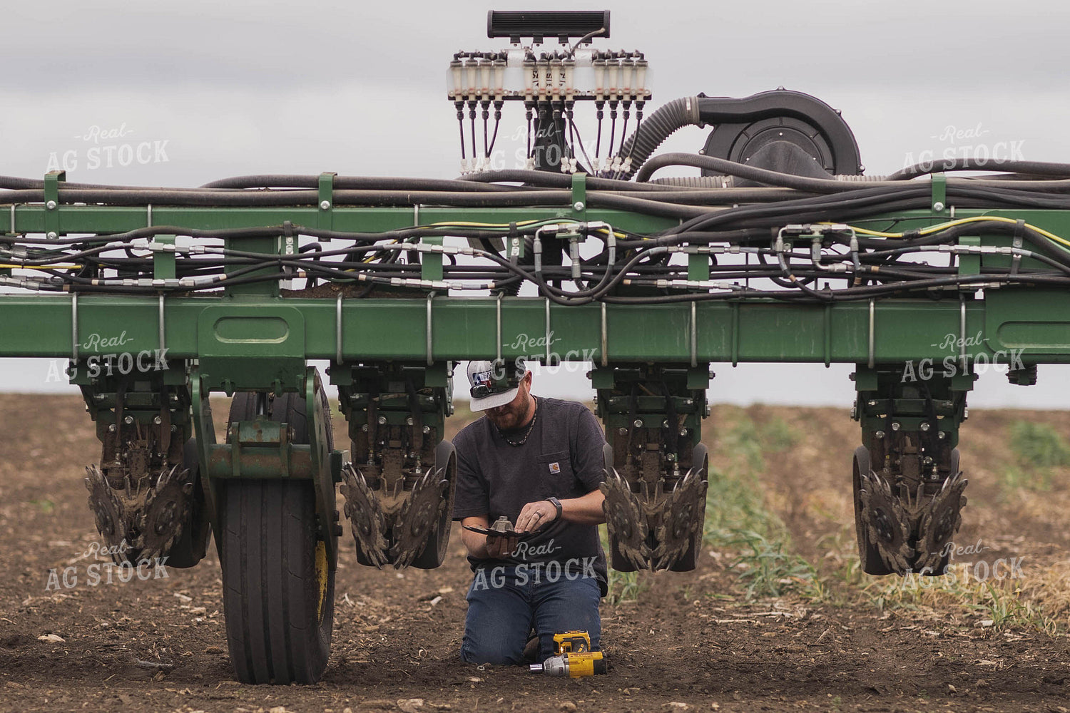 Farmer Repairing Planter 91006