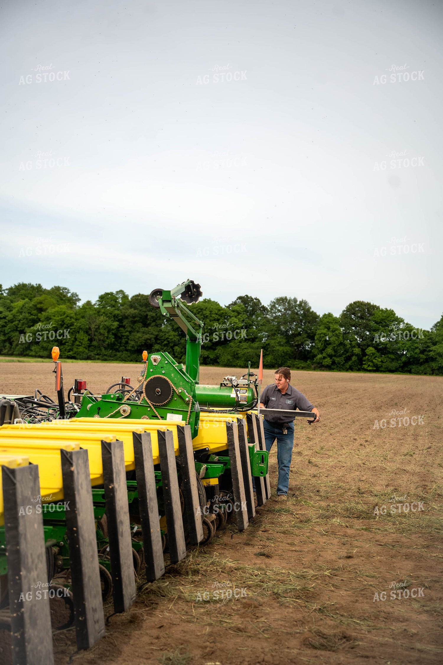 Female Farmer Filling Planter 115644