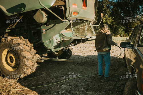 Farmer Using Air Hose to Clean Combine During Soybean Harvest 5201