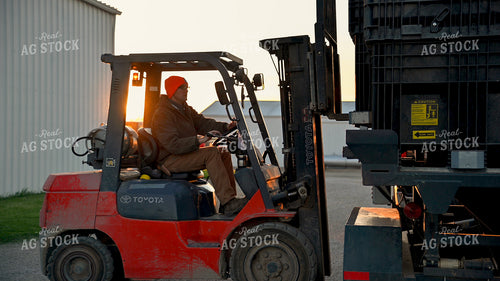 Loading the Seed Tender with the Skidsteer 25324