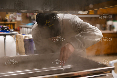 Farmer Cooking Maple Syrup 52813