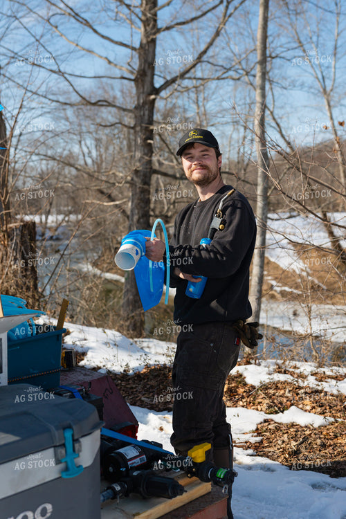 Farmer Tapping Maple Trees 52945