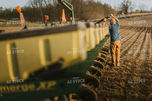Farmer Checking Seed Box on Planter 7451