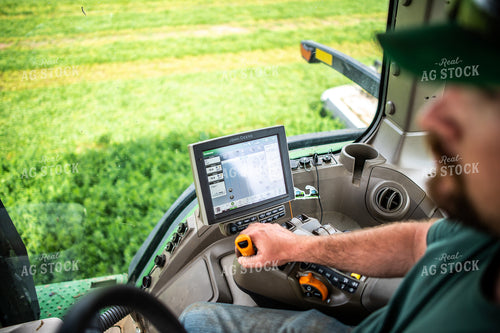 Farmer Driving Tractor with Equipment GPS Monitor Visible 56672
