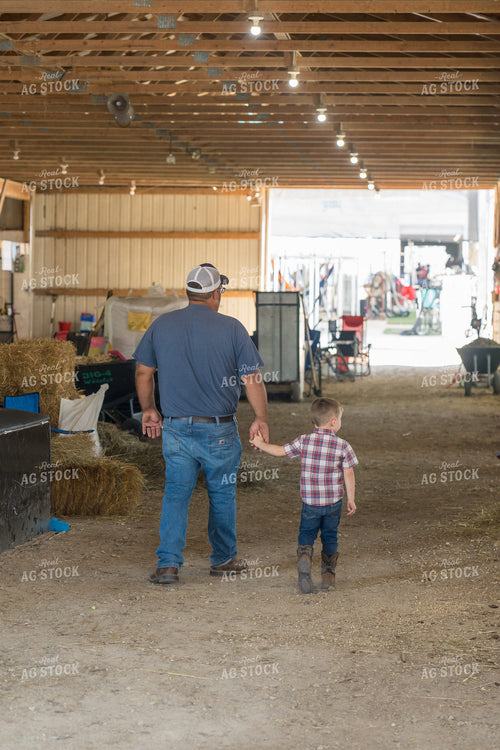 Farmer and Farm Kid Walking in Barn 52824