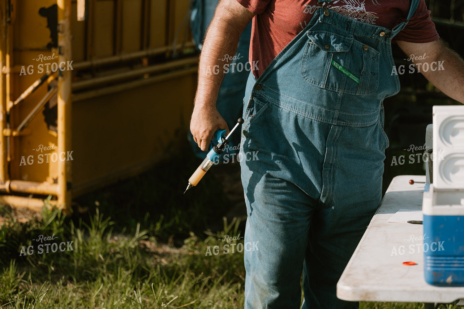 Farmer with Vaccine Gun 125375