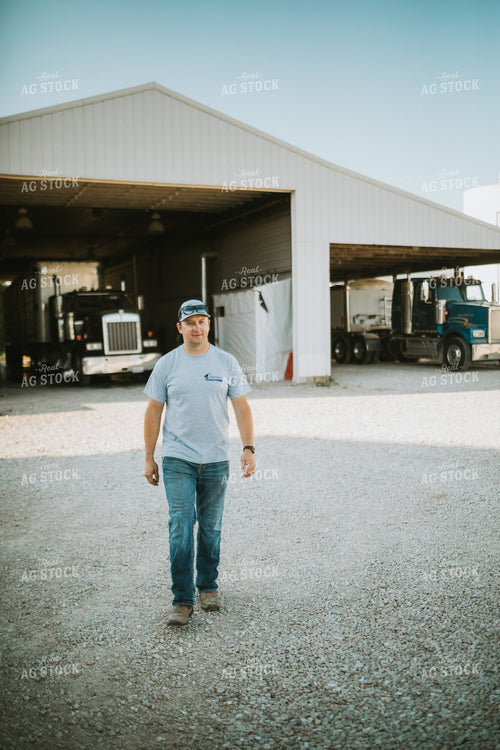 Farmer Walking in Farm Yard 6235