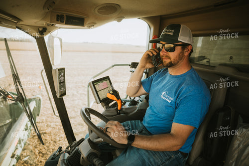 Farmer Talking on Phone in Combine 7208
