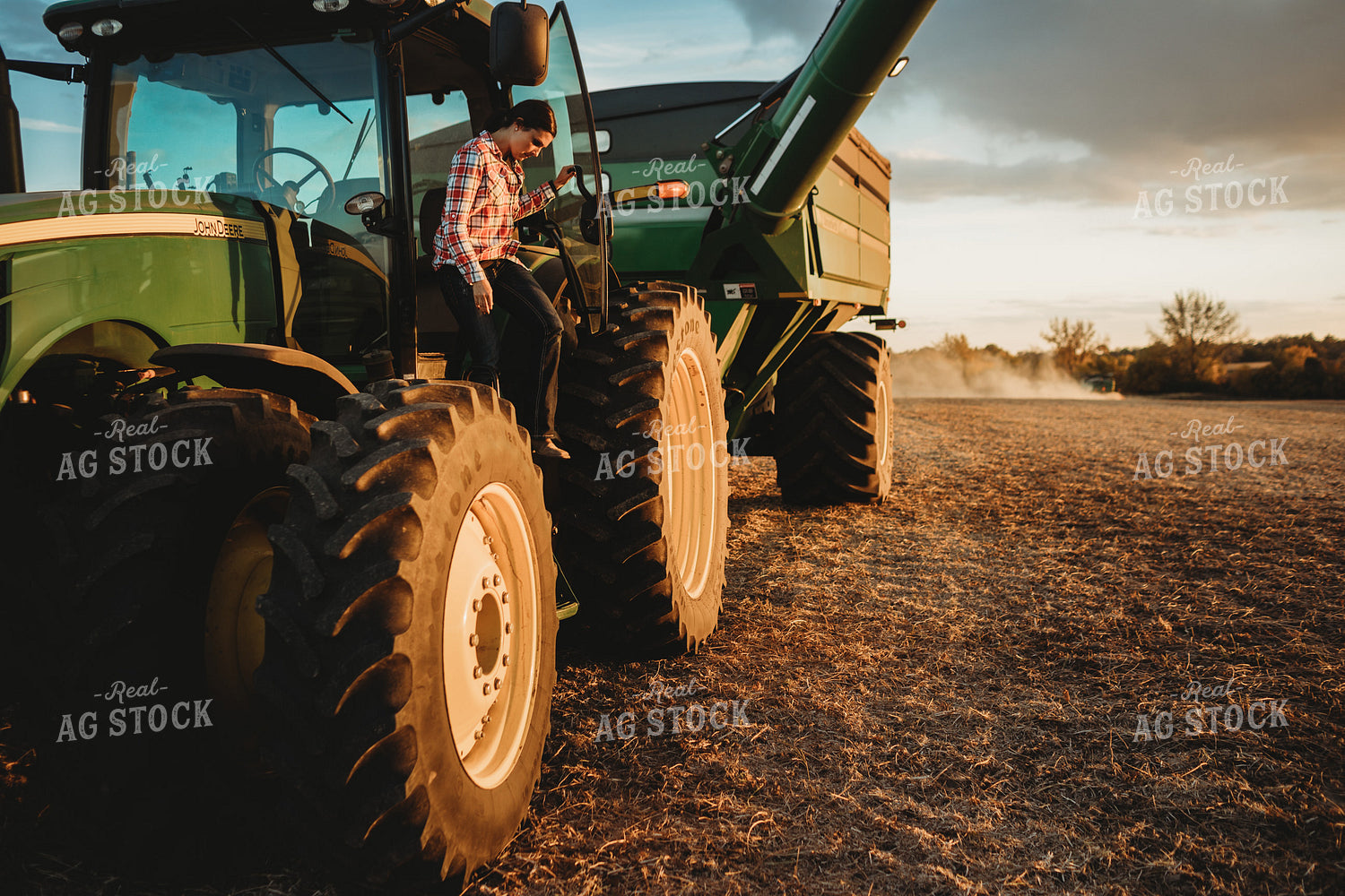 Female Farmer Climbing out of Tractor 3465