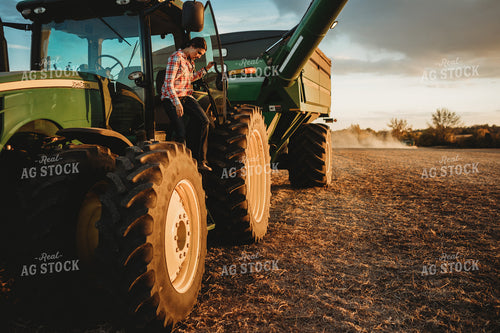 Female Farmer Climbing out of Tractor 3465