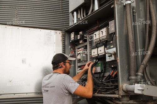 Farmer Fixing Grain Dryer 26017