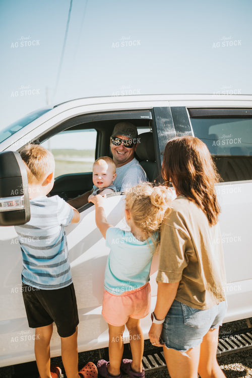 Farm Family Greeting Farmer in Pickup Truck 6165