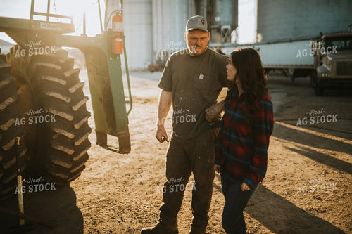 Farmer and Farm Wife Talking next to Combine 5052