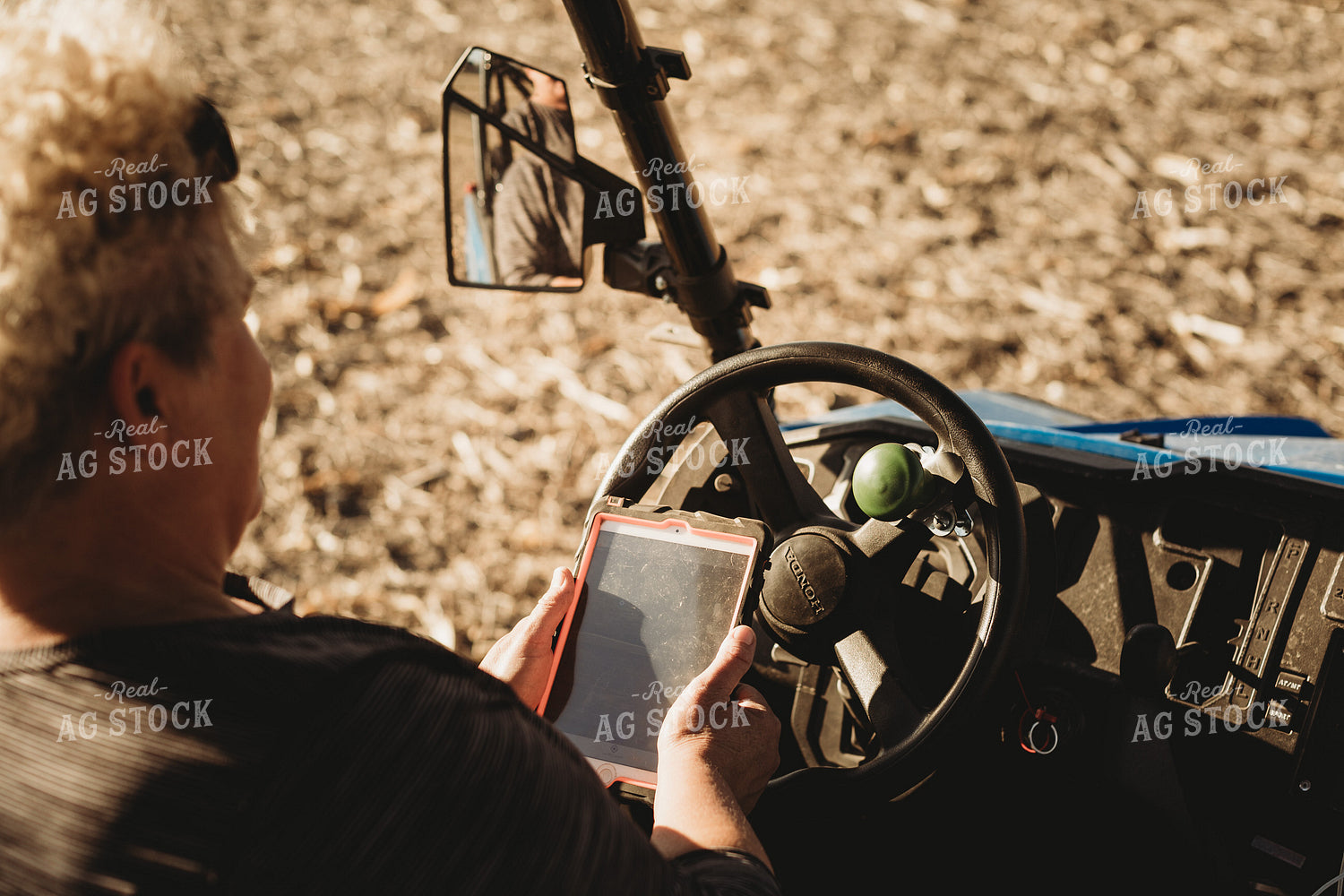 Farmer in Side by Side UTV with iPad 3726