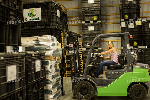 Young Woman Farmer Loads Pallet with Skid Steer 7489