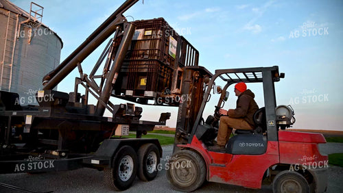 Loading the Seed Tender with a Skidsteer - 110
