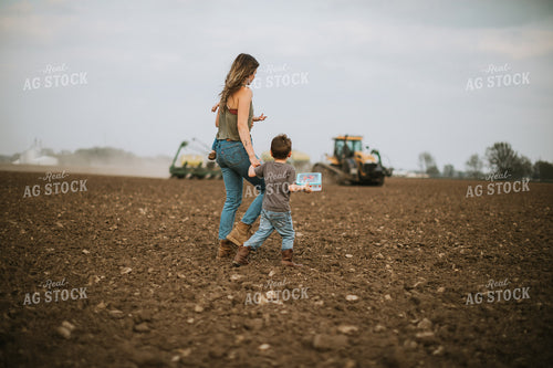 Farm Mom Taking Kids Out to Tractor During Planting 5635