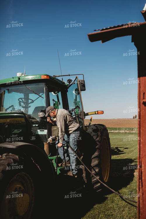 Farmer Fueling Up Tractor 4092