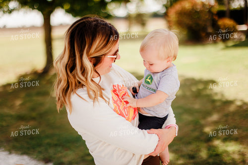 Farm Wife Holding Daughter 9311