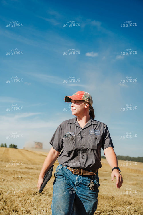 Female Farmer Walking in Field 115230