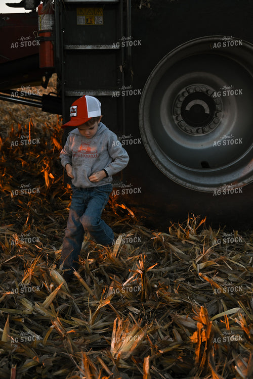 Farm Kid Walking by Combine 26306