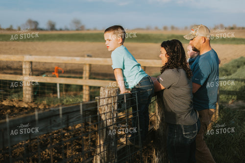 Farm Family Standing at Fence 7413